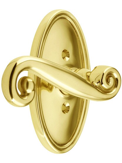 Oval Rosette Set With Scroll Design Levers Left Hand in Polished Brass.
